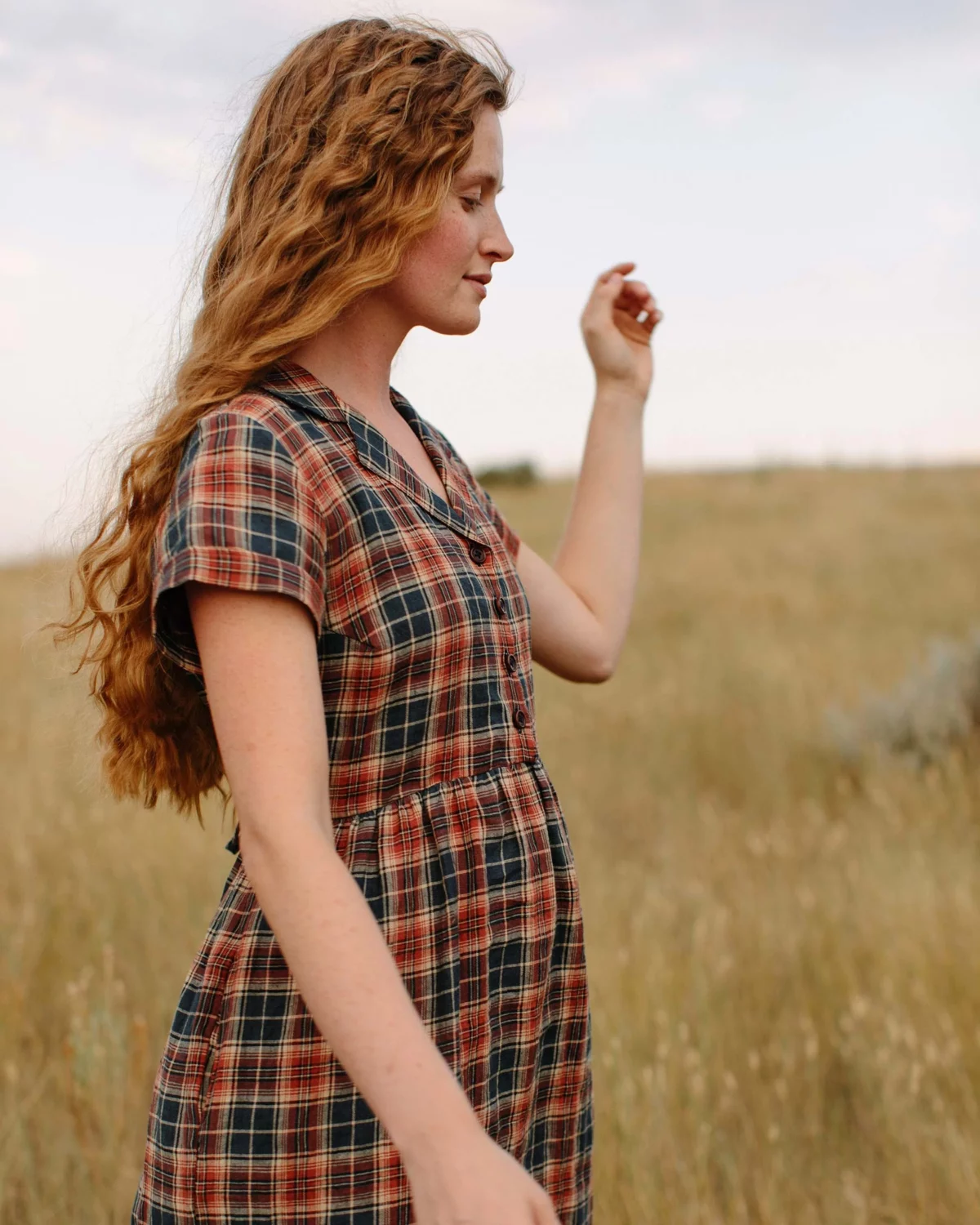 a woman wearing a linen dress made in the usa from pyne and smith