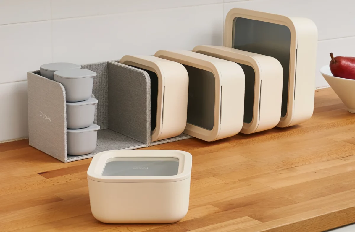 Different sizes of non-toxic food storage containers from Caraway, neatly arranged on the kitchen counter.