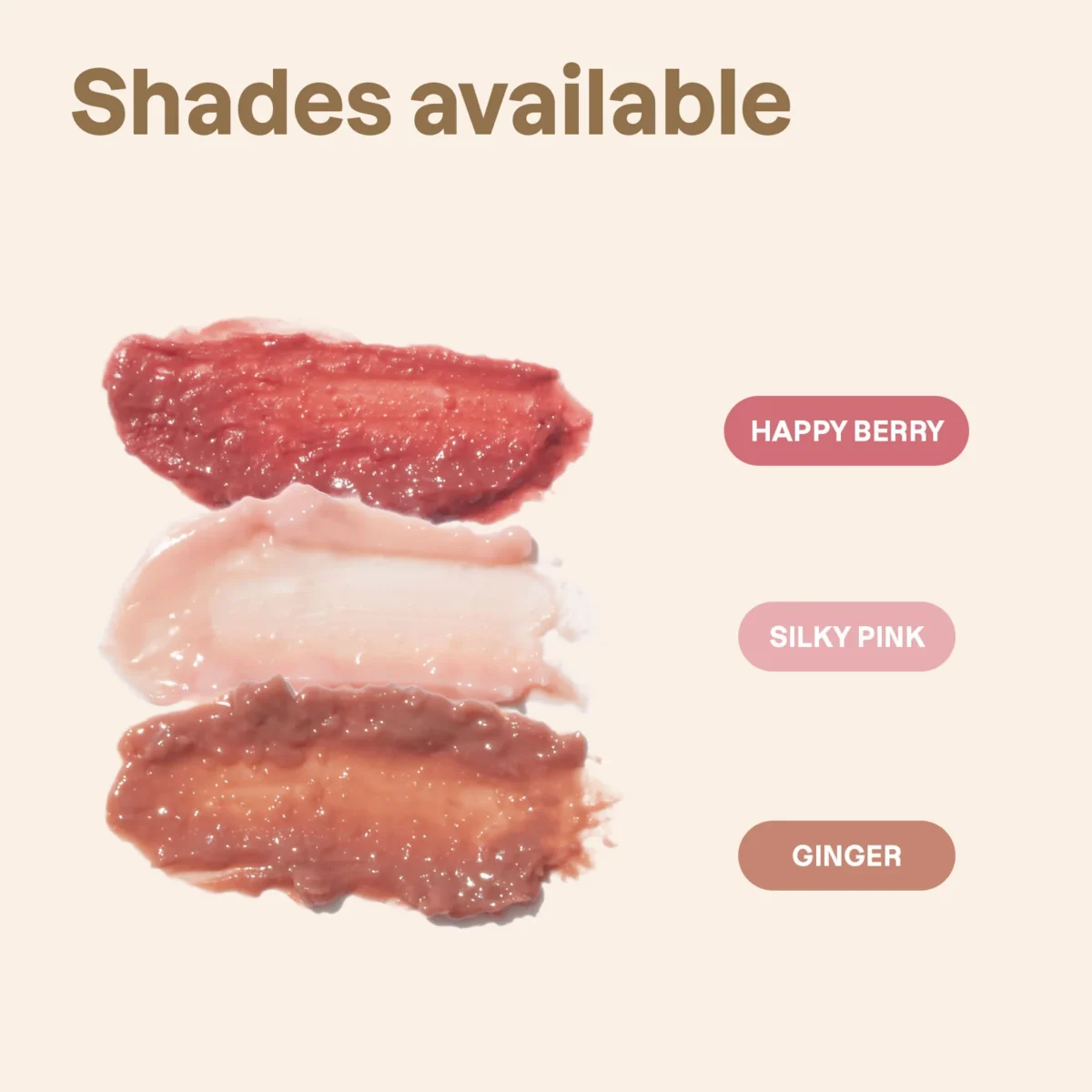The image displays three smears of lip gloss in the shades "Happy Berry," "Silky Pink," and "Ginger" against a plain off-white background.