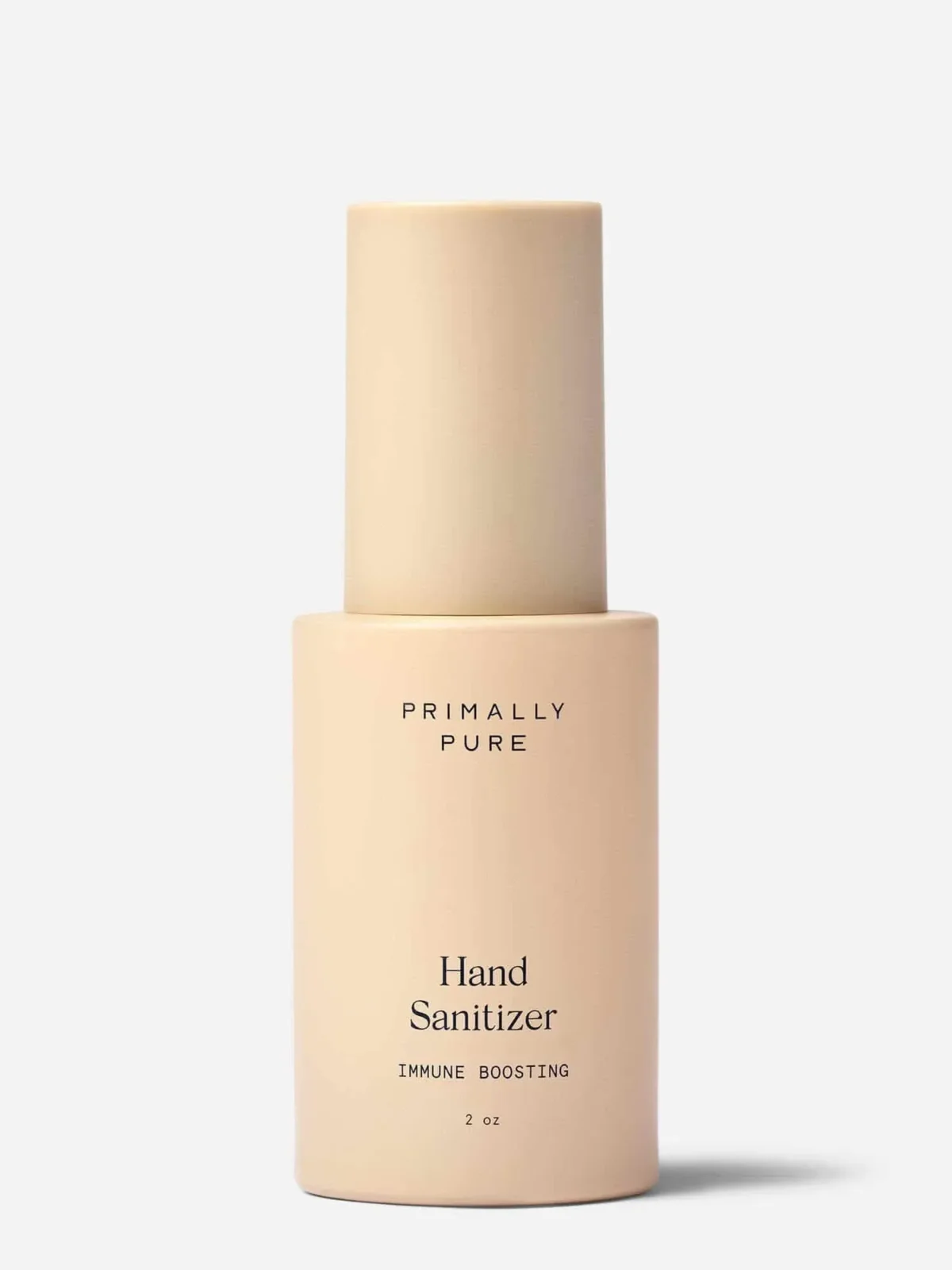 A beige bottle of Primally Pure Hand Sanitizer with “IMMUNE BOOSTING” written below. The bottle is cylindrical with a matching cap, photographed against a plain white background. Size indicated as 2 oz.
