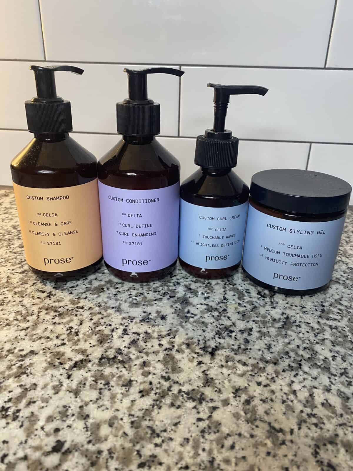 a line of several Prose haircare products lined up on the counter