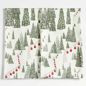 White tea towels with green woodland tree pattern and red gondola cable cars.