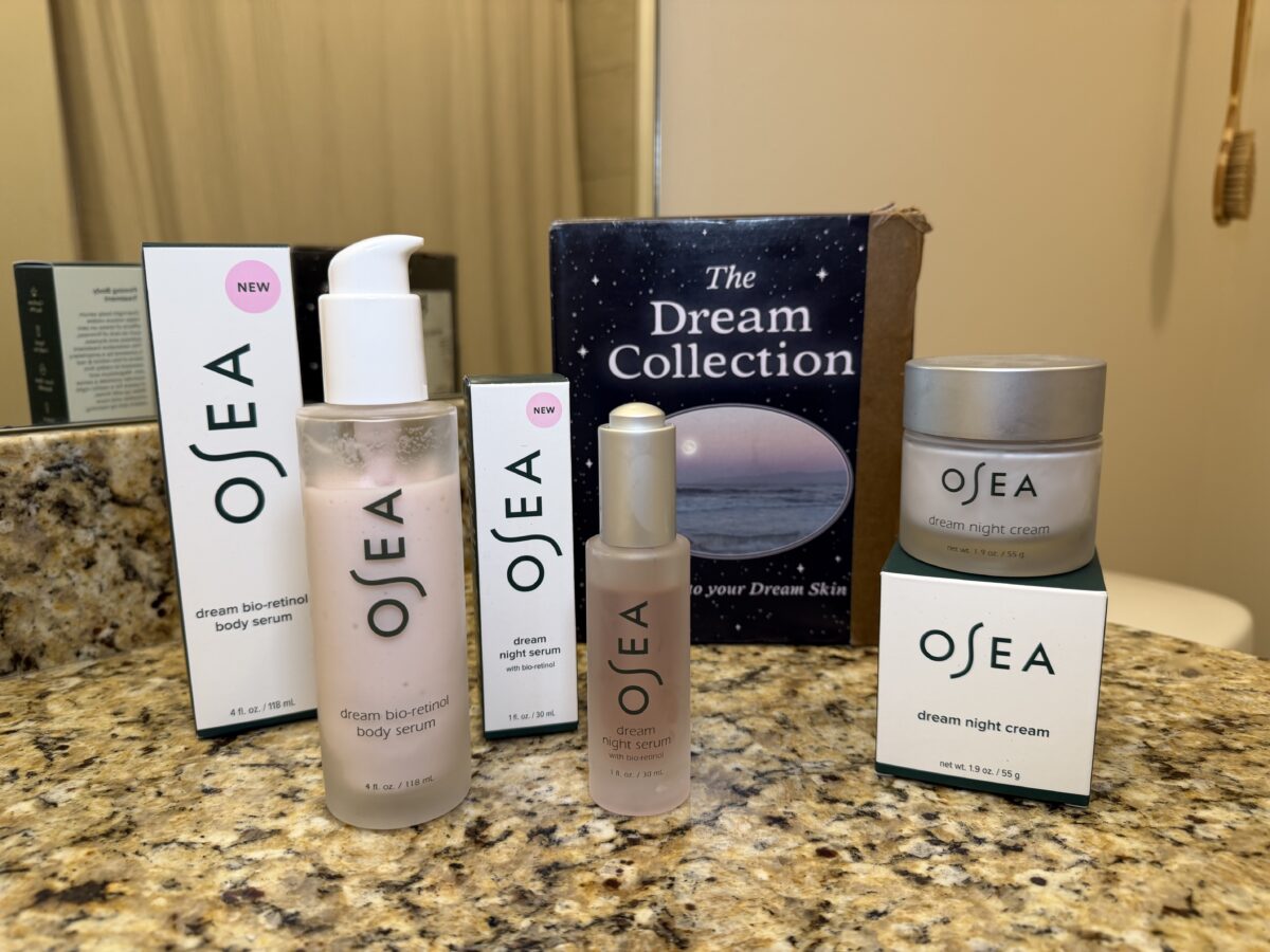 OSEA Dream Collection skincare products displayed on granite counter including bio-retinol body serum, night serum, night cream, and product packaging