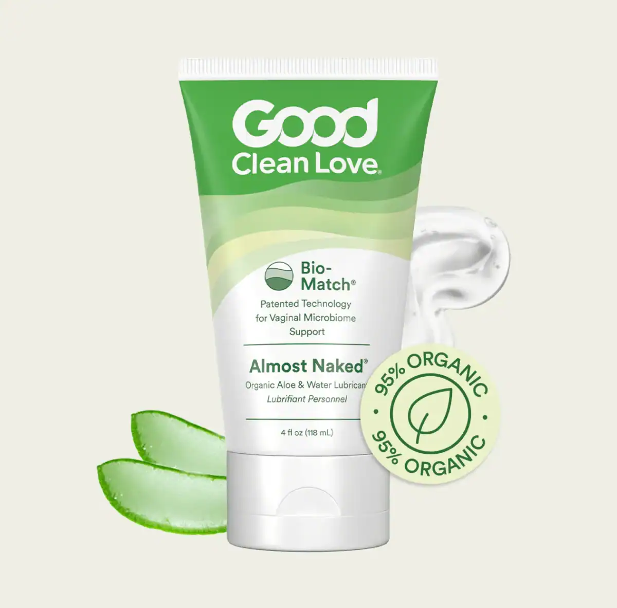 A squeeze tube of Good Clean Love "Almost Naked" Organic Aloe & Water Lubricant is displayed with a swirl of the product, two slices of aloe vera, and a label emphasizing its organic nature.
