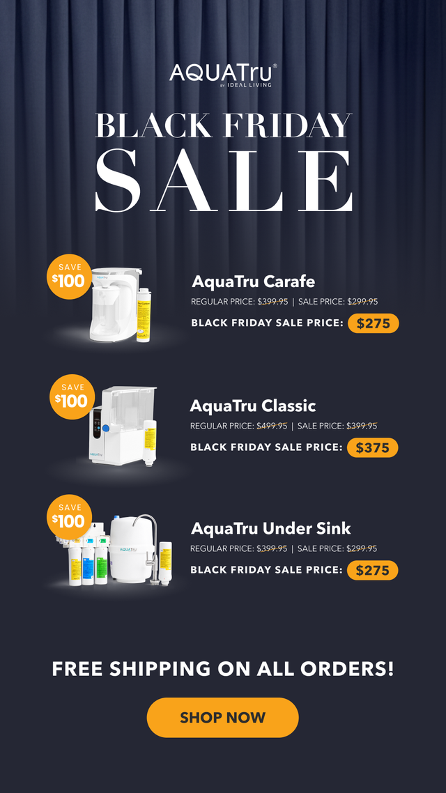 AquaTru water purifiers displayed against a dark curtain background with Black Friday sale pricing for the Carafe, Classic, and Under Sink models, each showing $100 savings and free shipping.