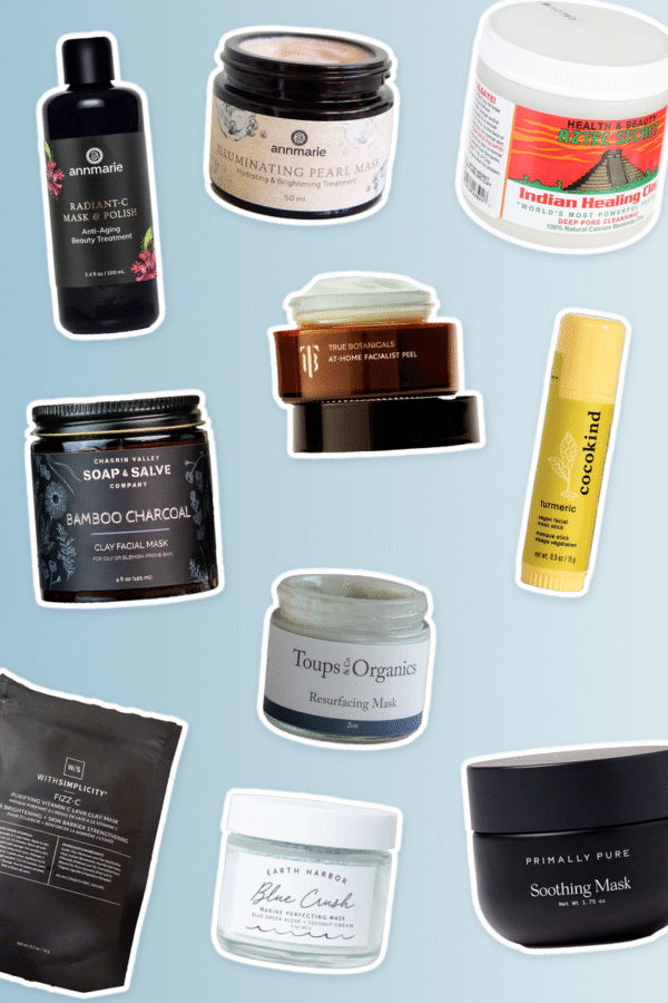 A collection of various skincare face mask products in jars, tubes, and sachets arranged against a light blue background.